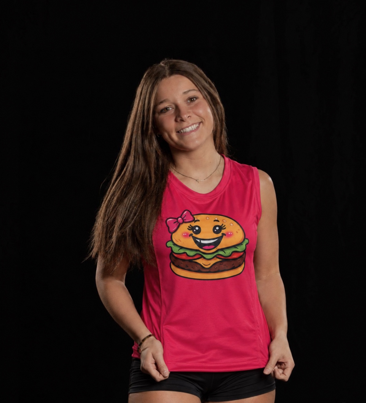Nyomie Dennis wearing a pink Burger Girlz shirt