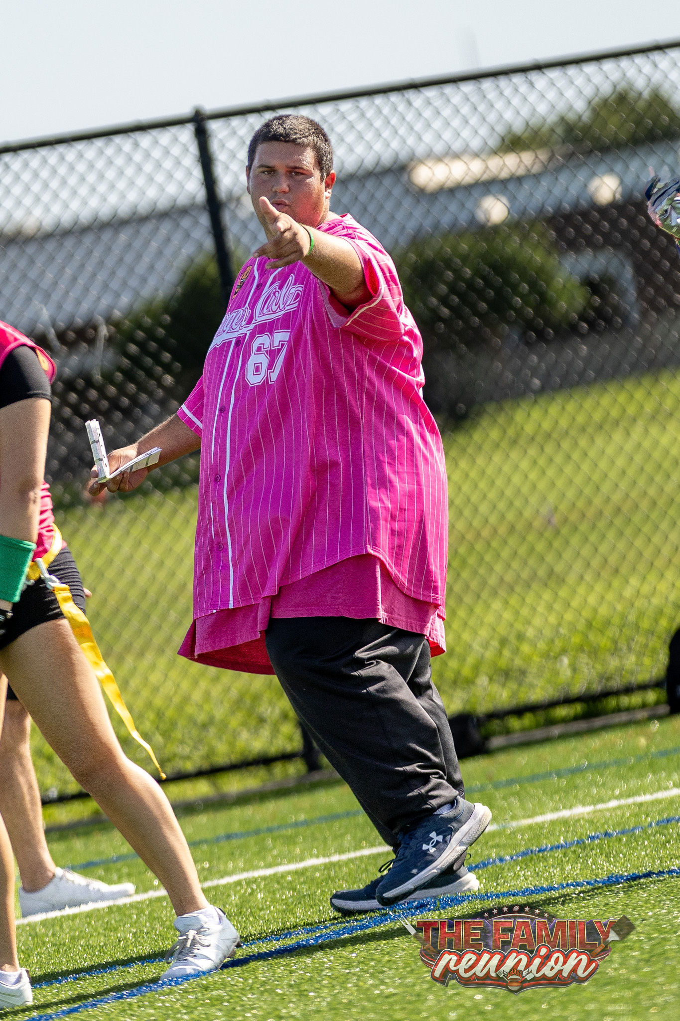 Rob DiMauro coaching Burger Girlz flag football from the sideline