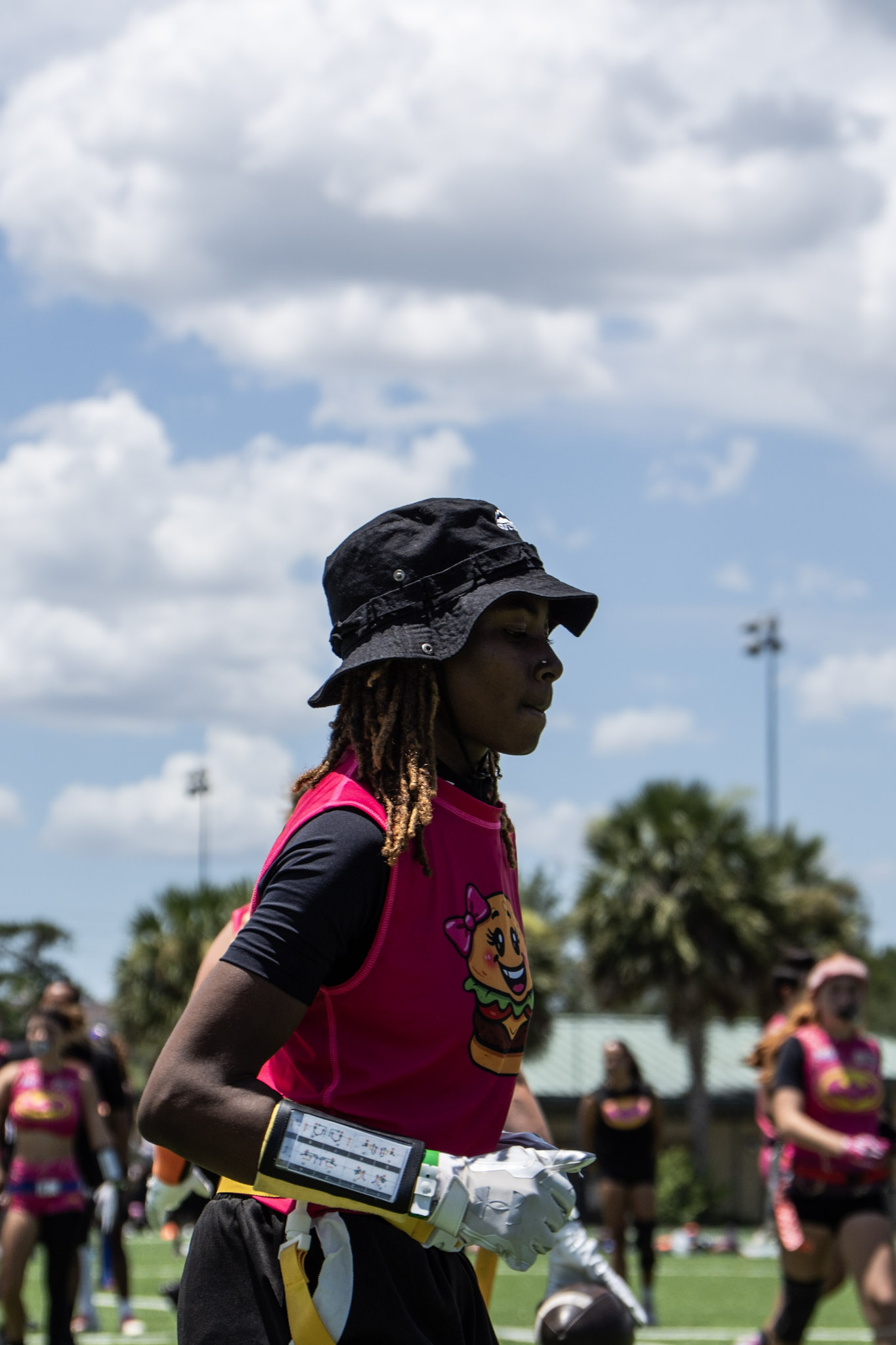 Terri Ammons on the flag football field in her Burger Girlz uniform